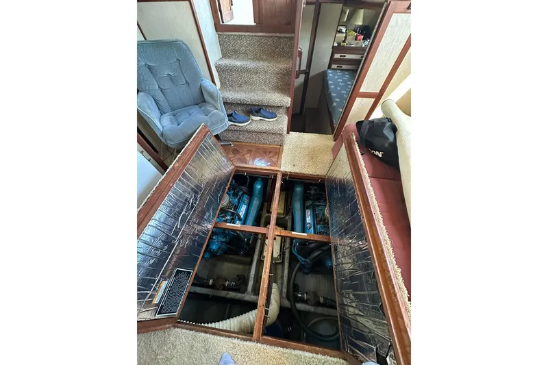 Slide: The Image of 1985 Carver 3207 Aft Cabin Motor Yacht interior with open engine compartment. - 28