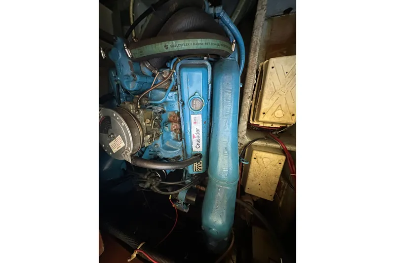 Slide: The Image of Engine of 1985 Carver 3207 Aft Cabin Motor Yacht, featuring blue components and wiring. - 31