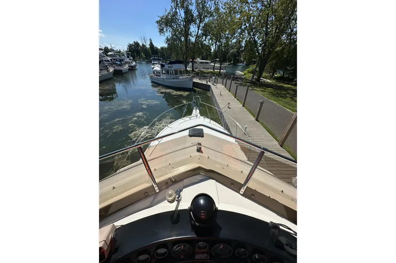 Slide: The Image of 1985 Carver 3207 Aft Cabin Motor Yacht docked at marina, sunny day. - 37