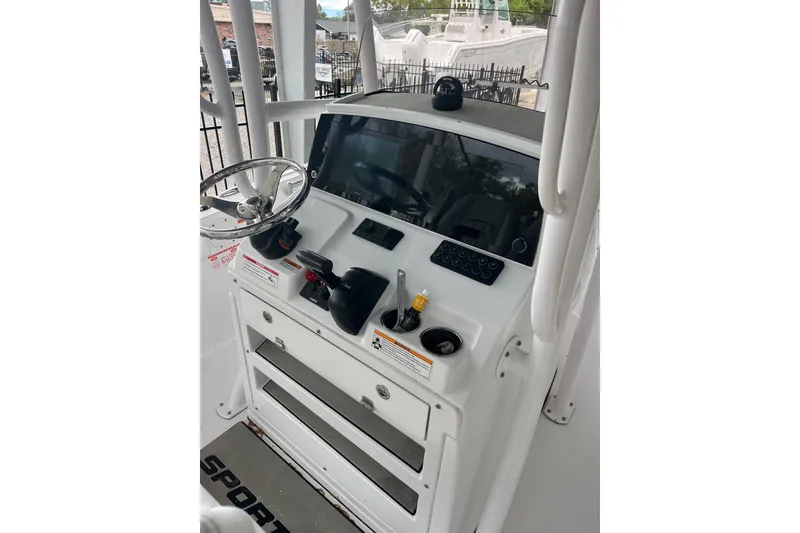 Slide: The Image of 2024 Sportsman Open 212 Center Console dashboard with steering wheel and controls. - 13