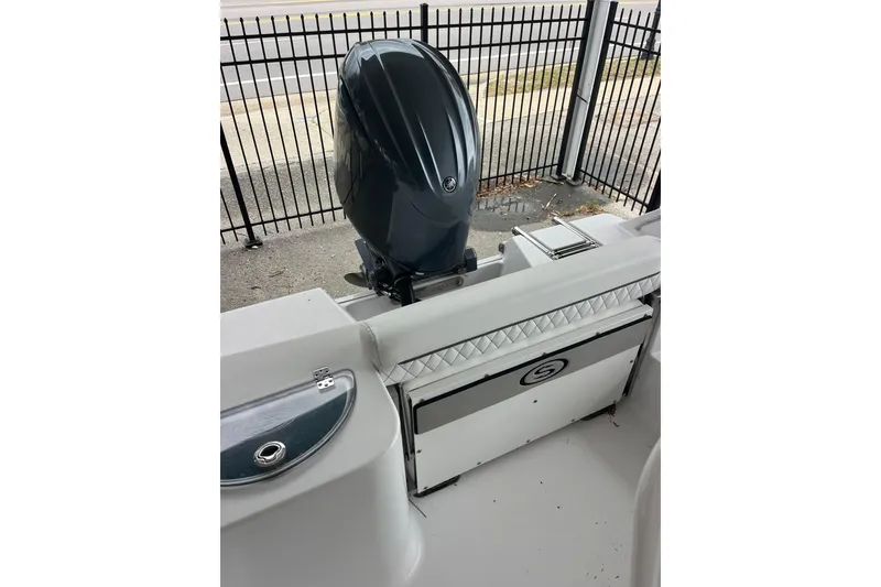 Slide: The Image of 2024 Sportsman Open 212 Center Console boat with outboard motor and seating. - 14