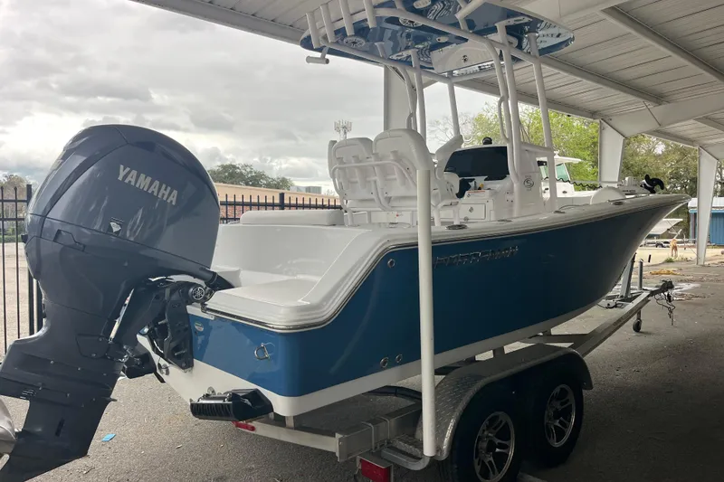 Slide: The Image of 2024 Sportsman Open 212 Center Console boat with Yamaha engine on trailer. - 4