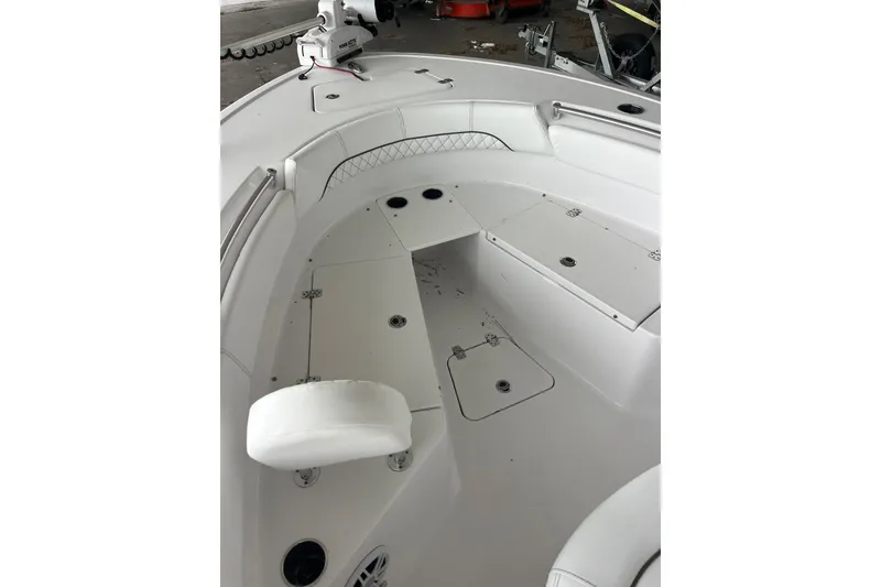 Slide: The Image of 2024 Sportsman Open 212 Center Console boat interior with seating and storage compartments. - 8