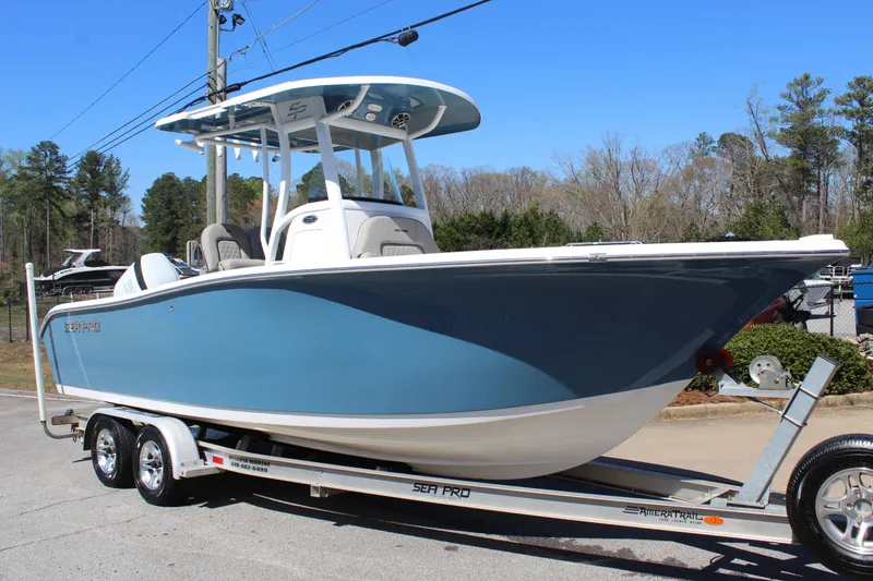 Slide: The Image of 2021 Sea Pro 239 DLX Center Console on trailer, blue. - 8