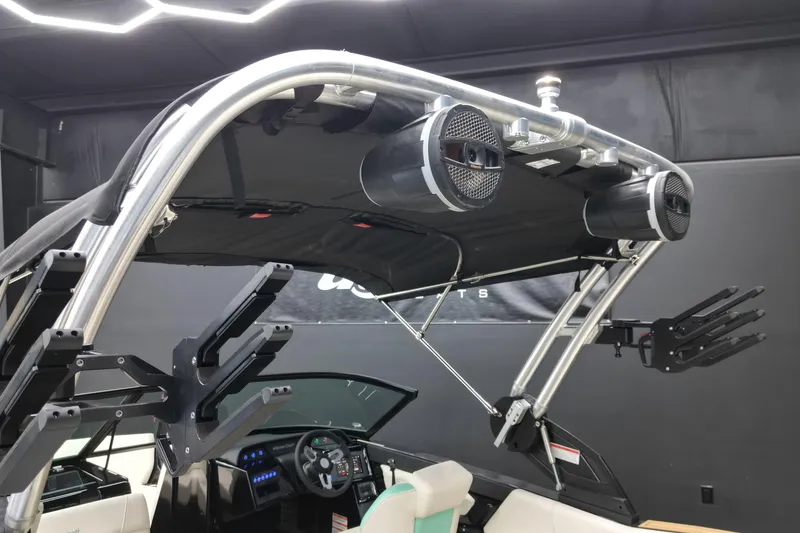 Slide: The Image of 2024 MasterCraft NXT21 boat interior with speakers and wakeboard racks. - 10