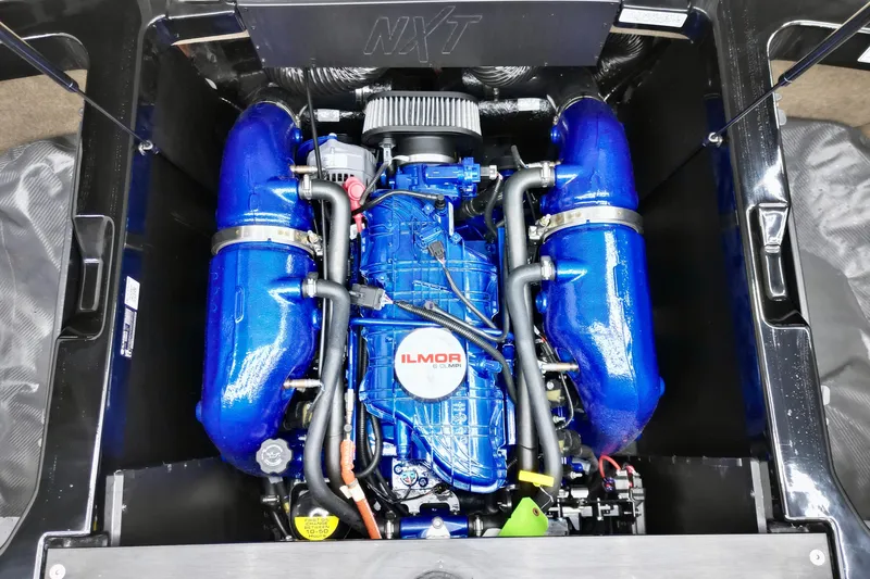 Slide: The Image of 2024 MasterCraft NXT21 Ilmor engine with blue components and detailed mechanics. - 11