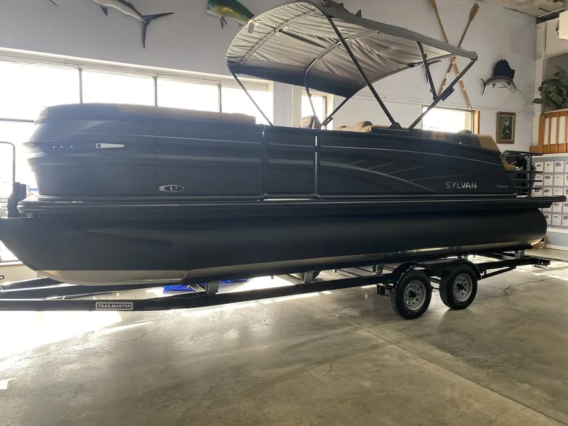 The Image of 2026 Sylvan L3 SLZ Platinum pontoon boat in showroom. - 1