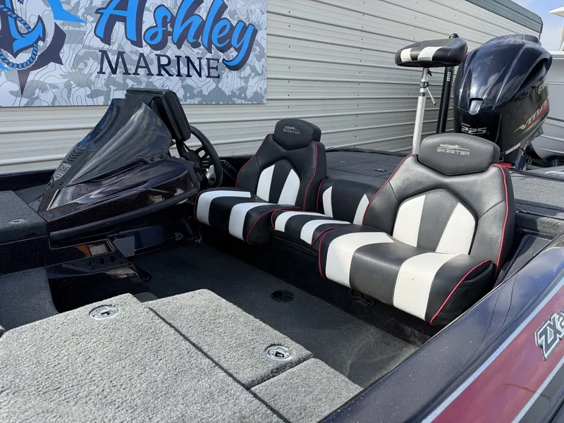 Slide: The Image of 2020 Skeeter ZX225 boat with black and white seats at Ashley Marine. - 10