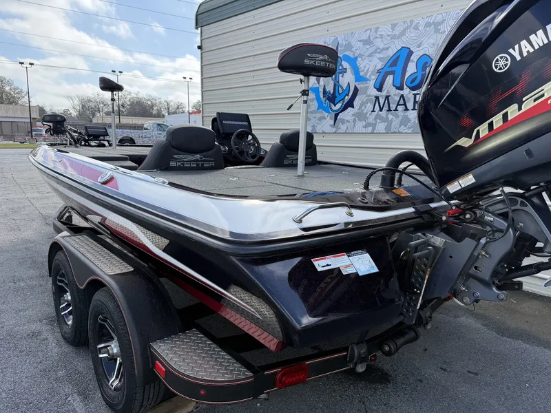 Slide: The Image of 2020 Skeeter ZX225 boat with Yamaha engine, parked on trailer. - 6