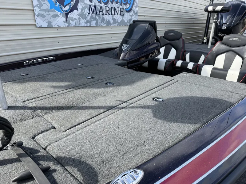 Slide: The Image of 2020 Skeeter ZX225 boat with gray deck and cushioned seats. - 7