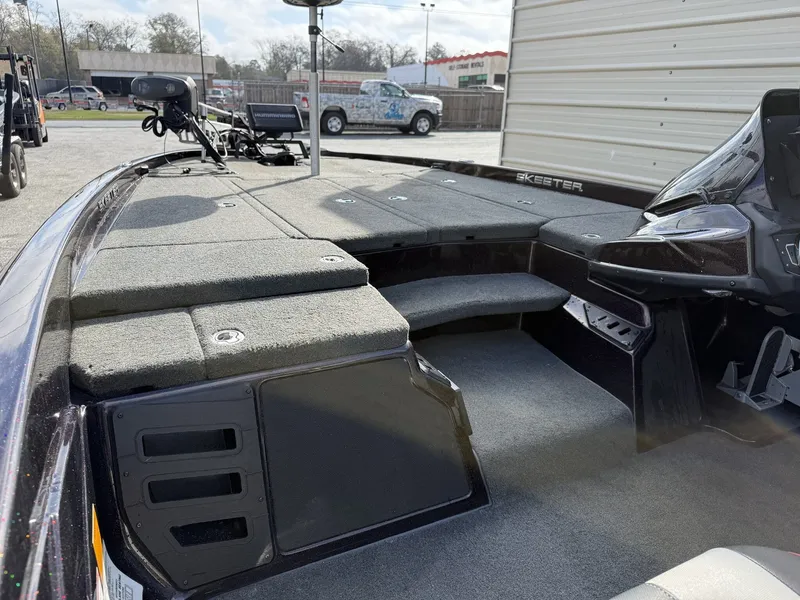 Slide: The Image of Interior view of a 2020 Skeeter ZX225 boat with gray carpeting. - 8