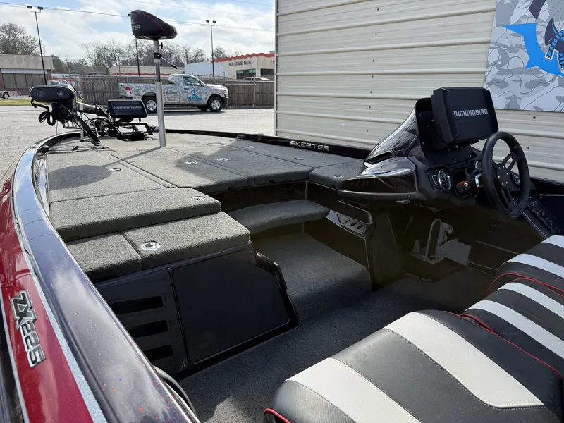 Slide: The Image of Interior view of a 2020 Skeeter ZX225 boat with steering console. - 9