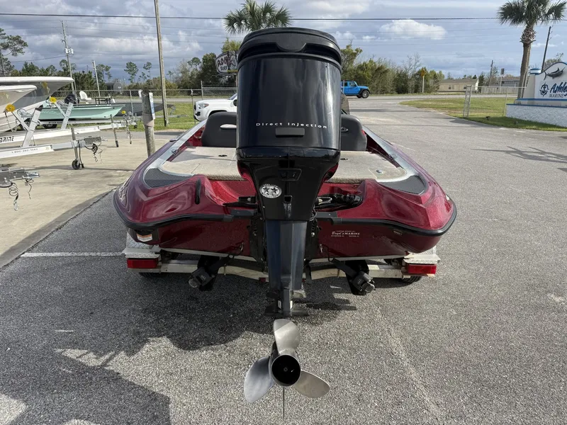 Slide: The Image of Red 2009 Triton Explorer 18 boat with outboard motor. - 4