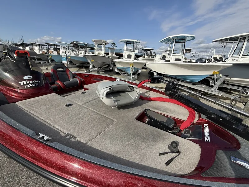Slide: The Image of 2009 Triton Explorer 18 boat at a marina. - 9