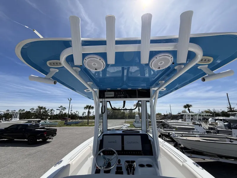Slide: The Image of 2021 Sea Hunt Gamefish 25 boat with blue canopy and Garmin equipment. - 12