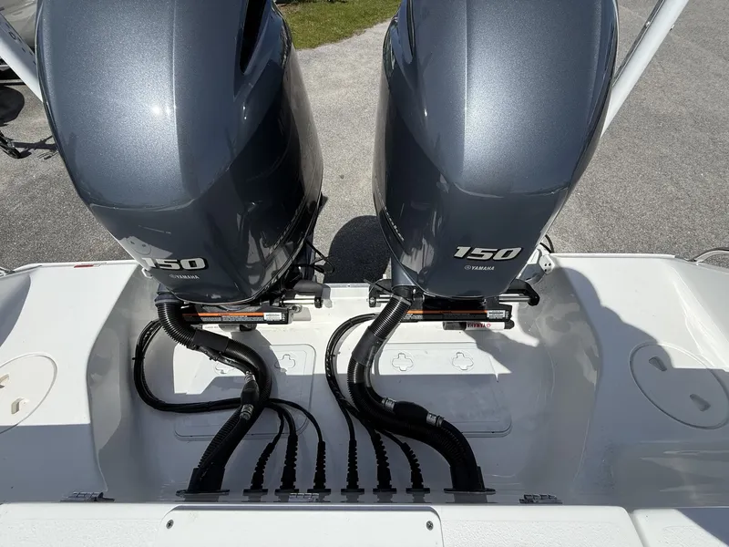 Slide: The Image of 2021 Sea Hunt Gamefish 25 with dual Yamaha 150 engines. - 14
