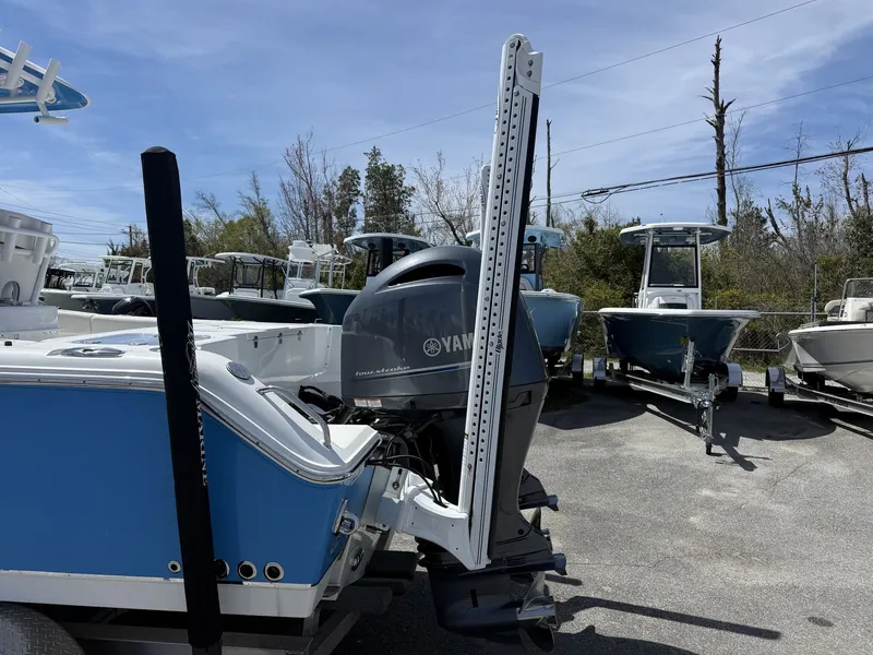 Slide: The Image of 2021 Sea Hunt Gamefish 25 with Yamaha engine in parking lot. - 6