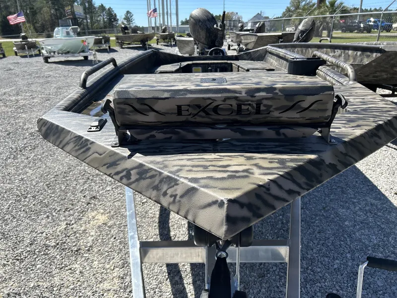 Slide: The Image of 2026 Excel 1751 Viper F4 boat with camouflage pattern on gravel lot. - 6