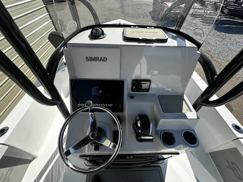 Slide: The Image of Interior view of 2026 Sea Pro 250 Bay helm with Simrad technology. - 5