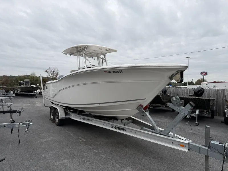 The Image of 2021 Sea Fox Commander 268 on trailer, cloudy sky. - 1