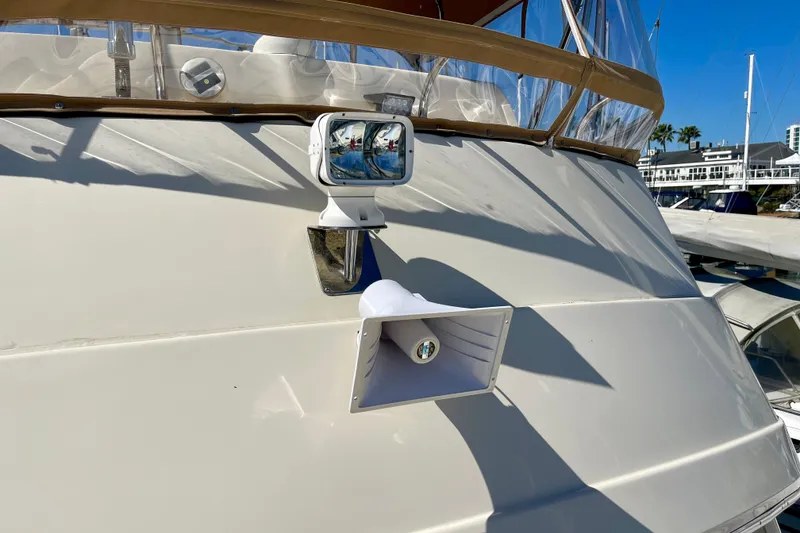 Slide: The Image of 2008 Mainship 34 Trawler with spotlight and horn on deck. - 18