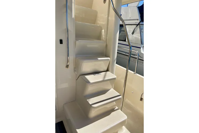 Slide: The Image of Staircase on 2008 Mainship 34 Trawler with stainless steel handrail. - 21