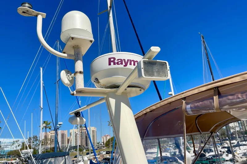 Slide: The Image of Radar and antenna equipment on a 2008 Mainship 34 Trawler against a clear blue sky. - 27