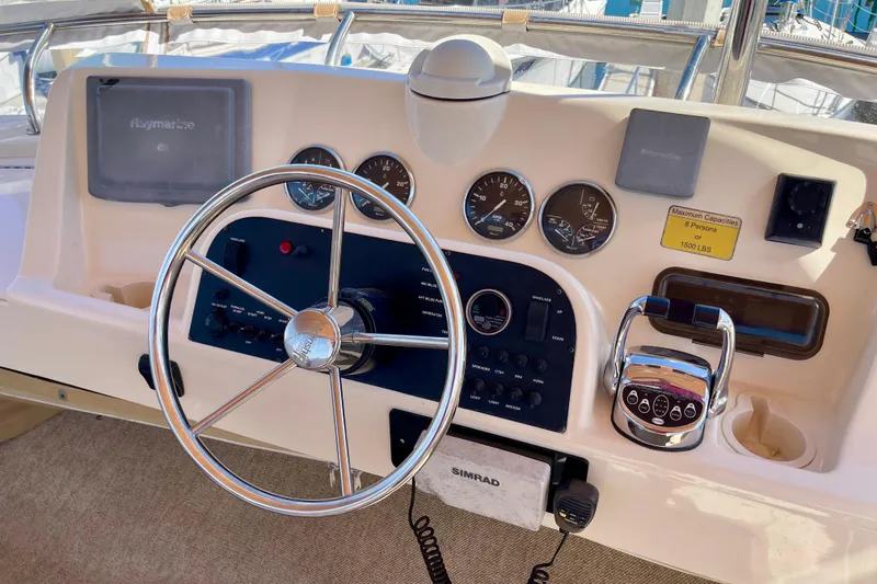 Slide: The Image of Steering console of a 2008 Mainship 34 Trawler with navigation instruments and controls. - 31