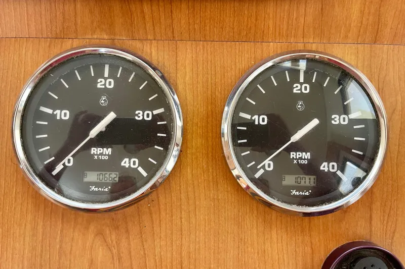 Slide: The Image of RPM gauges on 2008 Mainship 34 Trawler dashboard, displaying engine performance. - 39