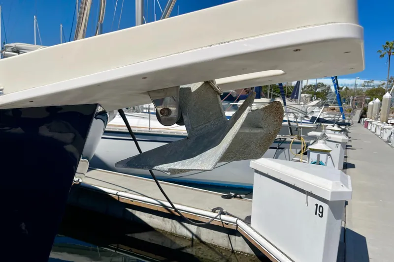 Slide: The Image of 2008 Mainship 34 Trawler anchor at marina dock, clear blue sky background. - 5