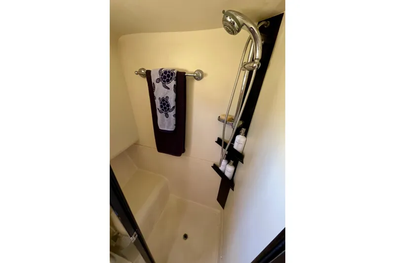 Slide: The Image of Shower area in 2008 Mainship 34 Trawler with towel and toiletries. - 55