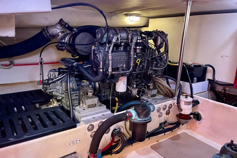 Slide: The Image of Engine room of a 2008 Mainship 34 Trawler, showcasing detailed mechanical components. - 58