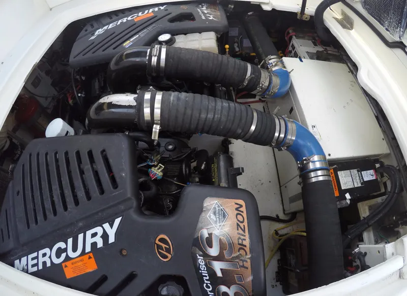 Slide: The Image of Engine compartment of 2005 Cruisers Yachts 340 Express with Mercury engines. - 8