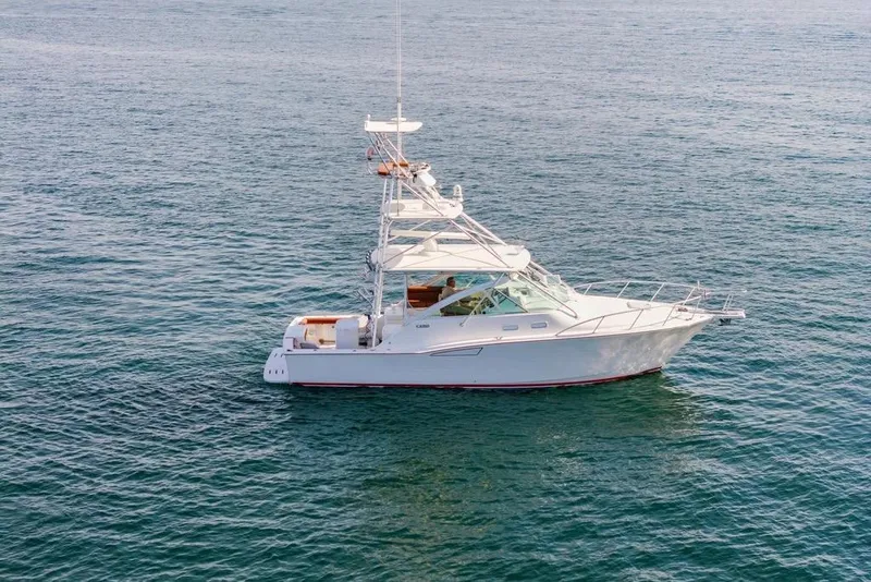 The Image of 2003 Cabo 35 Express boat on calm ocean waters. - 1