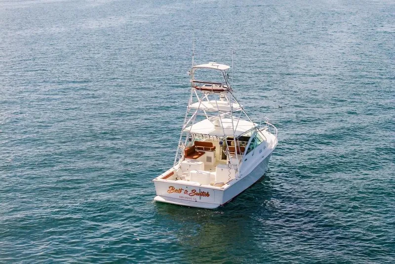 Slide: The Image of 2003 Cabo 35 Express boat on open water, viewed from above. - 11