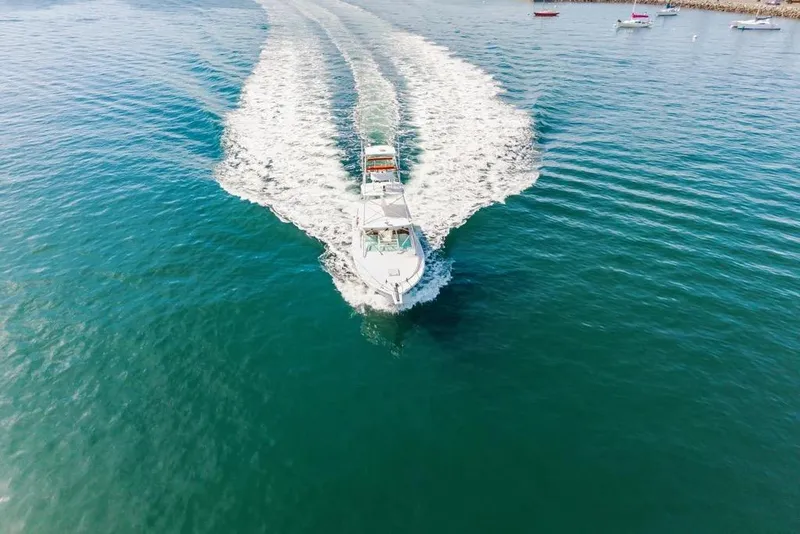 Slide: The Image of Aerial view of 2003 Cabo 35 Express boat cruising on open water. - 12