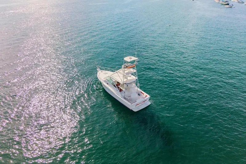 Slide: The Image of Aerial view of 2005 Cabo 35 Express boat on calm ocean waters. - 26