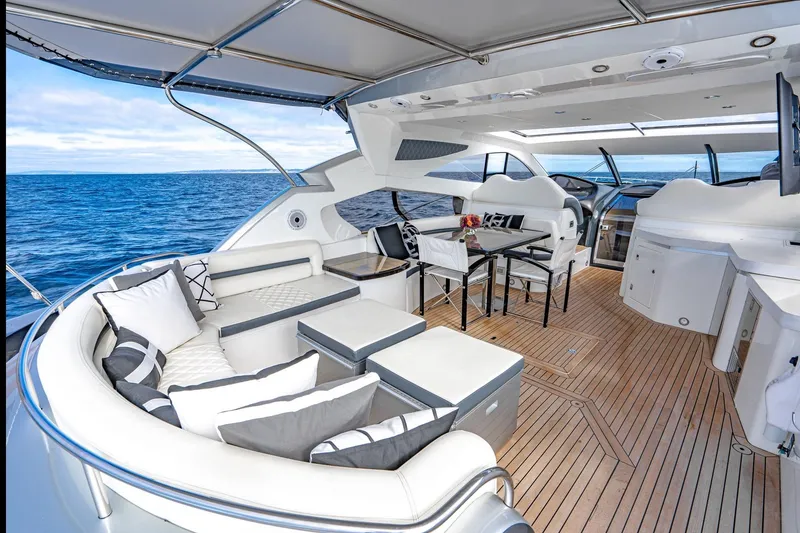 Slide: The Image of Luxurious Sunseeker Predator 68 yacht interior, 2021 model, featuring elegant seating and ocean view. - 20