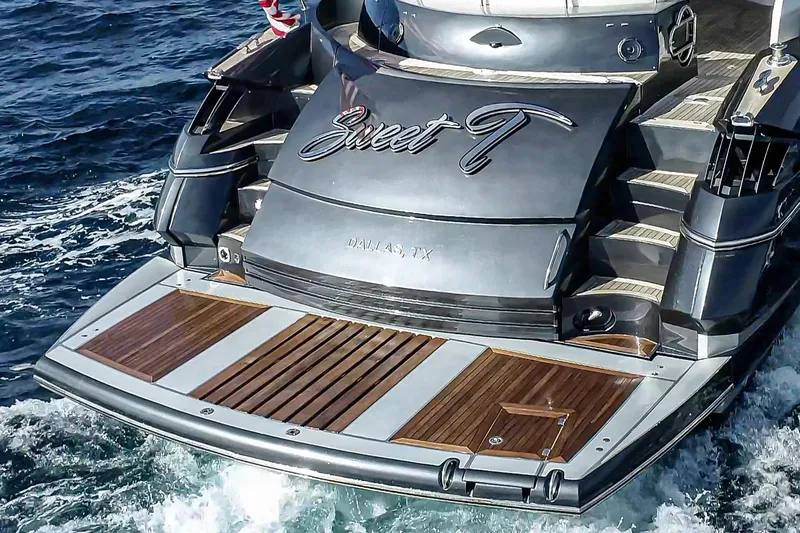 Slide: The Image of 2021 Sunseeker Predator 68 yacht with wooden deck, cruising on ocean waters. - 3