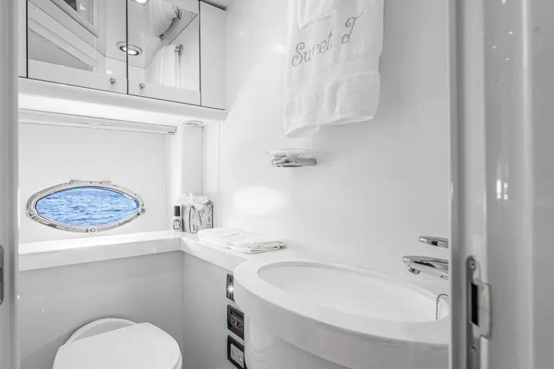 Slide: The Image of Luxurious bathroom in 2021 Sunseeker Predator 68 yacht with ocean view porthole. - 31