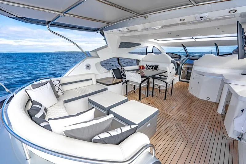 Slide: The Image of Luxurious Sunseeker Predator 68 yacht interior, 2021 model, featuring elegant seating and ocean view. - 6