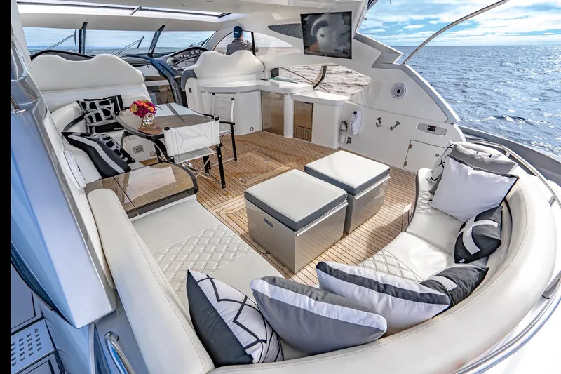 Slide: The Image of Luxurious Sunseeker Predator 68 yacht interior, 2021 model, featuring elegant seating and ocean view. - 9