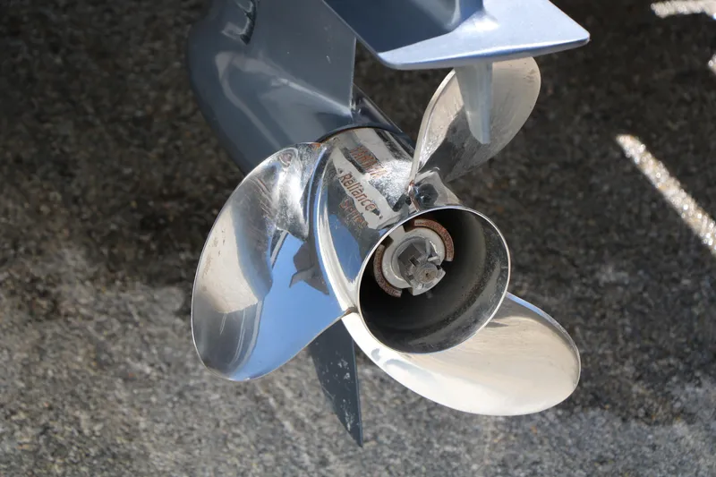 Slide: The Image of Close-up of a 2016 Sea Hunt BX 22 BR boat propeller on pavement. - 13