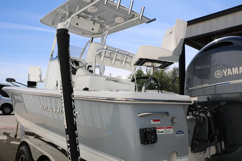 Slide: The Image of 2016 Sea Hunt BX 22 BR boat with Yamaha engine, docked outdoors. - 14