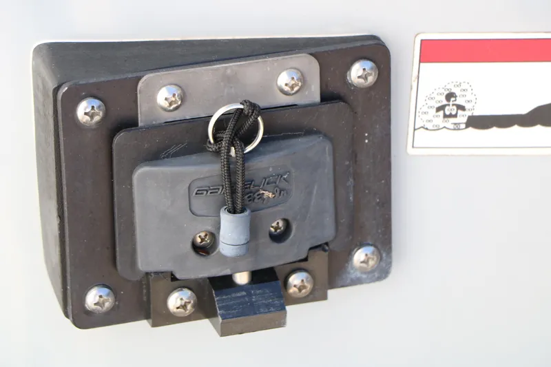 Slide: The Image of 2016 Sea Hunt BX 22 BR boat detail showing a secured lock mechanism. - 15