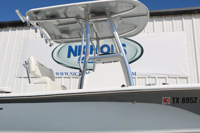 Slide: The Image of 2016 Sea Hunt BX 22 BR boat with T-top, displayed at dealership. - 19
