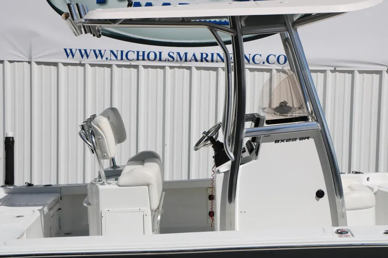 Slide: The Image of 2016 Sea Hunt BX 22 BR boat interior with steering console and seating. - 23