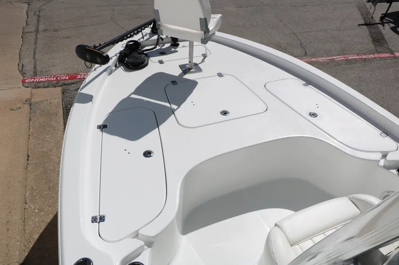 Slide: The Image of 2016 Sea Hunt BX 22 BR boat deck with storage compartments and seating. - 30