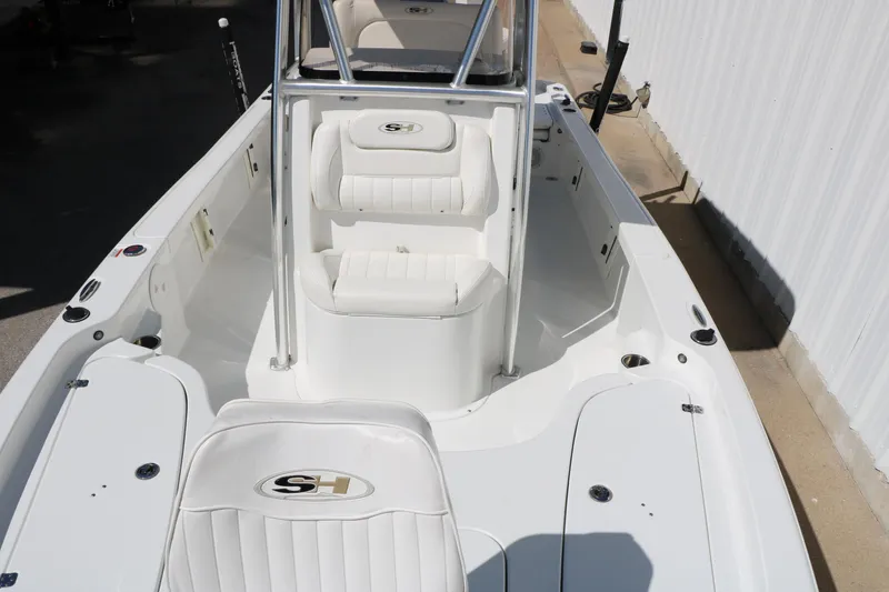 Slide: The Image of 2016 Sea Hunt BX 22 BR boat interior with white seating and console. - 35