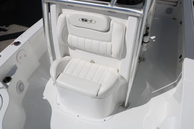 Slide: The Image of 2016 Sea Hunt BX 22 BR boat interior with white cushioned seating. - 37